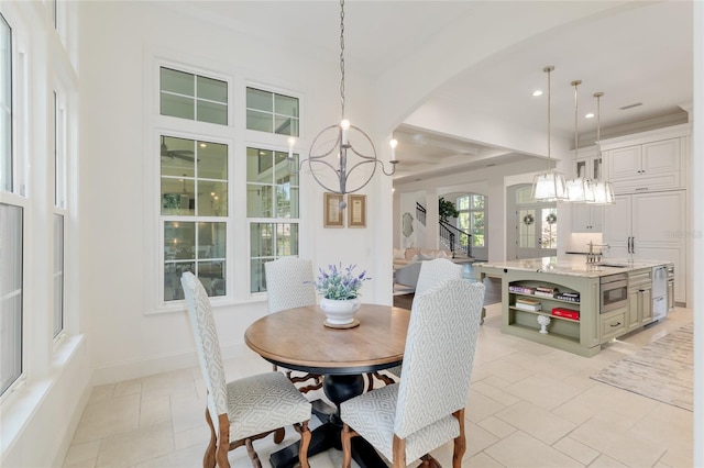 14819 NW 21st Ave, Newberry, FL 32669 - dining space featuring recessed lighting, baseboards, arched walkways, and a chandelier