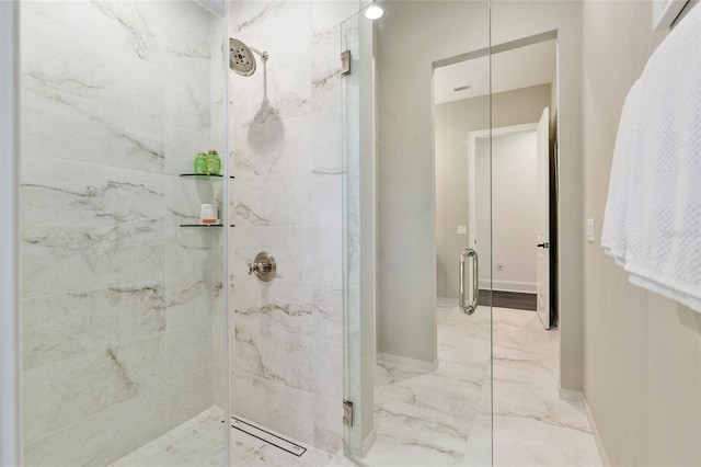 14819 NW 21st Ave, Newberry, FL 32669 - bathroom with a shower stall, marble finish floor, and baseboards