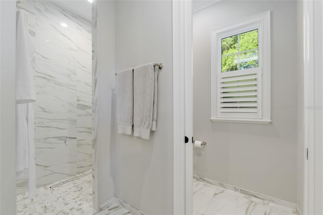 14819 NW 21st Ave, Newberry, FL 32669 - bathroom featuring baseboards, marble finish floor, and a marble finish shower