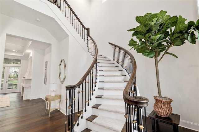 14819 NW 21st Ave, Newberry, FL 32669 - stairs with wood finished floors, a towering ceiling, baseboards, and french doors