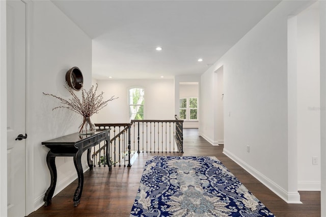 14819 NW 21st Ave, Newberry, FL 32669 - corridor featuring baseboards, wood finished floors, an upstairs landing, and recessed lighting