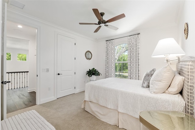 14819 NW 21st Ave, Newberry, FL 32669 - bedroom featuring crown molding, multiple windows, and carpet