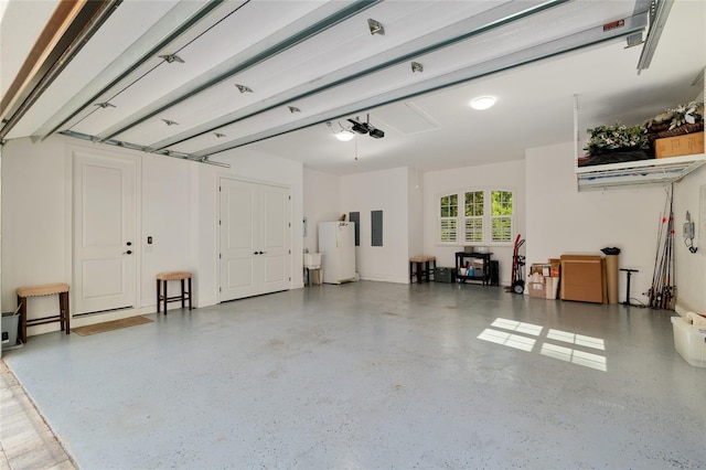 14819 NW 21st Ave, Newberry, FL 32669 - garage featuring water heater, electric panel, and a garage door opener