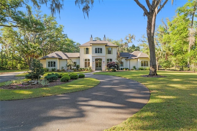 14819 NW 21st Ave, Newberry, FL 32669 - french country inspired facade featuring stucco siding, a chimney, and a front yard
