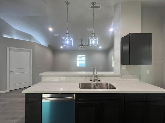 kitchen with a sink, dishwasher, visible vents, lofted ceiling, and dark wood-style floors