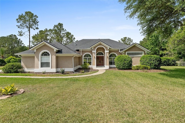 12918 SW 28th Pl, Archer, FL 32618 - view of front facade featuring a front lawn and stucco siding