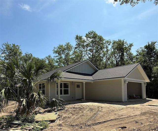 6333 Fox Hollow Ct, Hampton, FL 32044 - view of front facade featuring a garage and board and batten siding