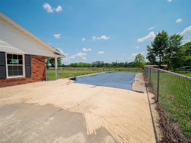 view of pool featuring a fenced in pool, a patio area, and fence