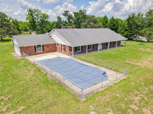 view of pool with fence, a fenced in pool, and a yard