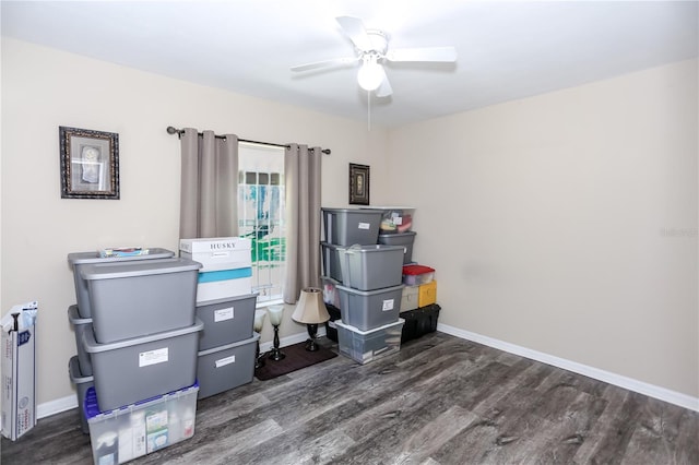 home office featuring ceiling fan, baseboards, and wood finished floors