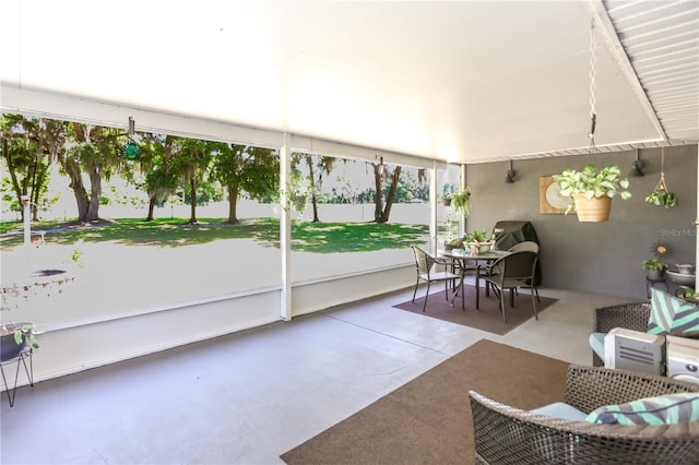sunroom with outdoor dining space