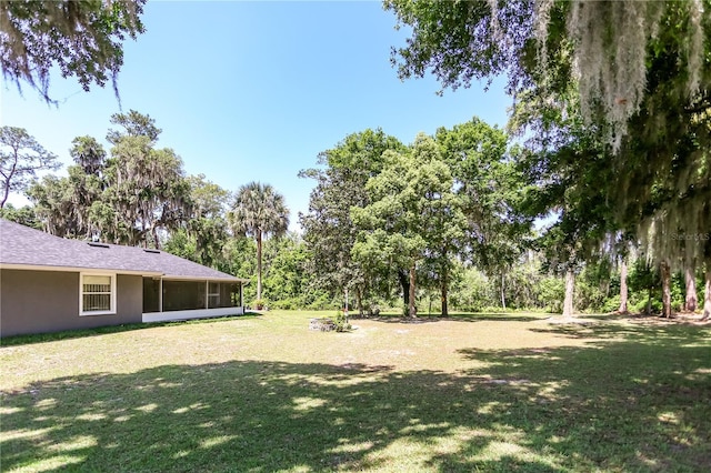 view of yard featuring a sunroom
