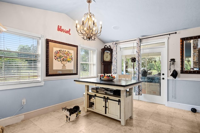 interior space with vaulted ceiling, a chandelier, and baseboards