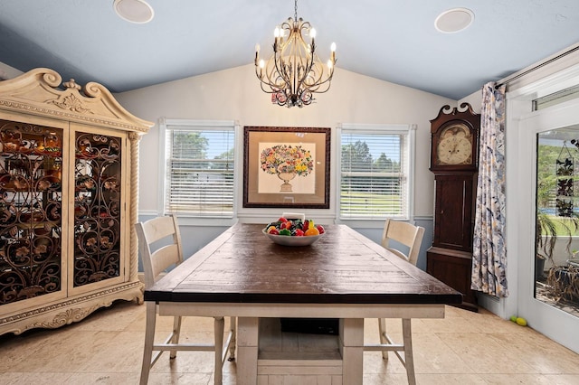 dining room featuring light tile patterned floors, a notable chandelier, and vaulted ceiling