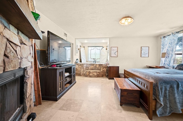 bedroom featuring a fireplace