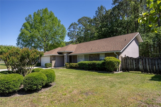 3653 NW 67th Ave, Gainesville, FL 32653 - ranch-style home featuring a garage, brick siding, a front lawn, and fence