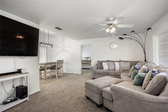 3653 NW 67th Ave, Gainesville, FL 32653 - carpeted living room featuring baseboards, visible vents, and ceiling fan