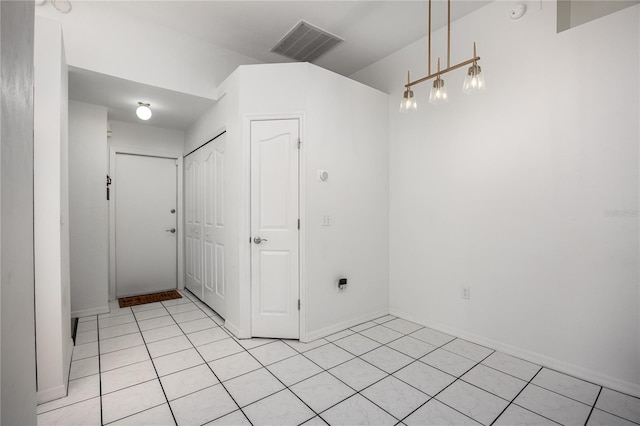 3653 NW 67th Ave, Gainesville, FL 32653 - spare room featuring baseboards, visible vents, and light tile patterned floors