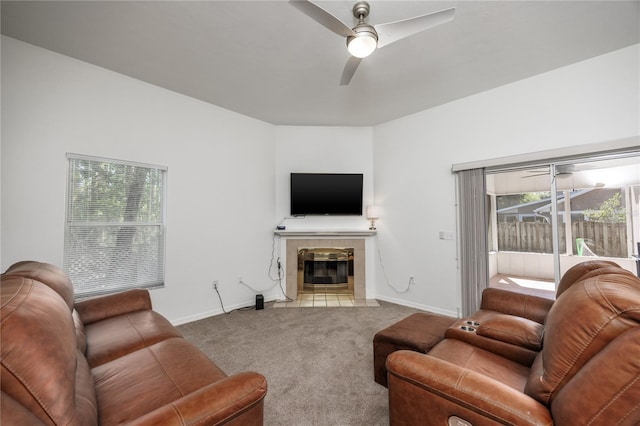 3653 NW 67th Ave, Gainesville, FL 32653 - living area featuring ceiling fan, baseboards, carpet flooring, and a tiled fireplace