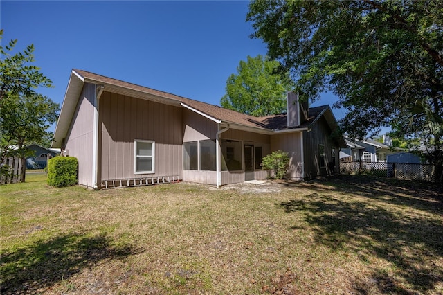 3653 NW 67th Ave, Gainesville, FL 32653 - back of house with a yard, a chimney, and fence