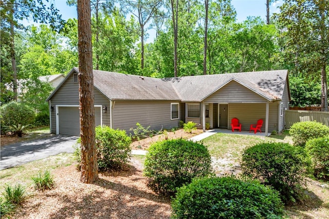 8202 SW 47th Rd, Gainesville, FL 32608 - ranch-style house with driveway and roof with shingles