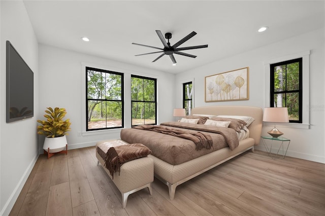 bedroom featuring recessed lighting, baseboards, a ceiling fan, and wood finished floors