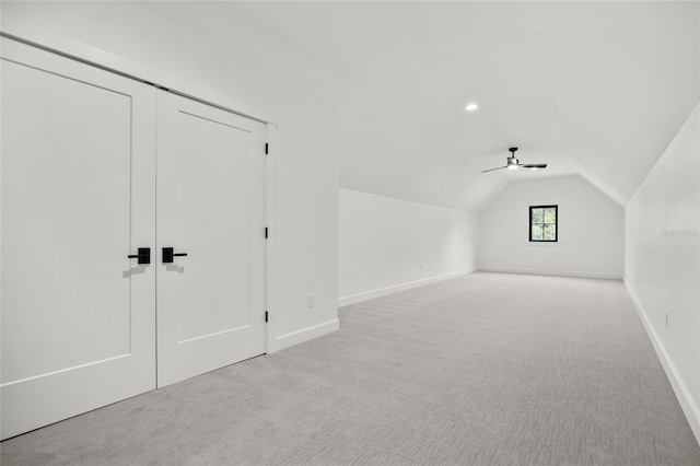 bonus room featuring carpet floors, baseboards, and vaulted ceiling