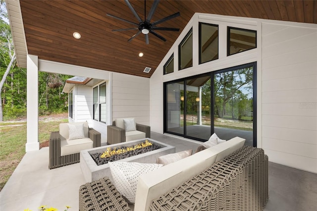 view of patio with ceiling fan, an outdoor fire pit, and visible vents