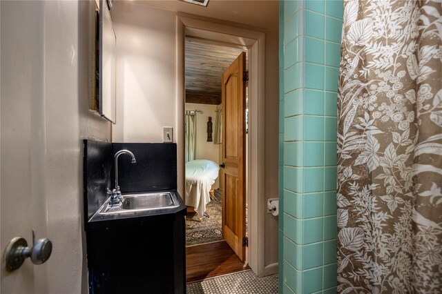 2074 NW 11th Rd, Gainesville, FL 32605 - bathroom with vanity, tile patterned floors, and a shower with shower curtain