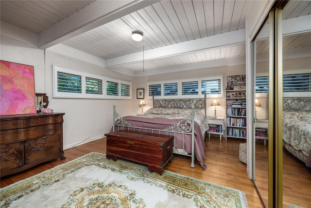 2074 NW 11th Rd, Gainesville, FL 32605 - bedroom with wood finished floors and wooden ceiling with exposed beams