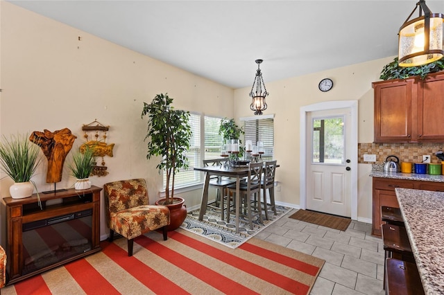 6546 NW 109th Pl, Alachua, FL 32615 - dining area with light tile patterned floors and baseboards
