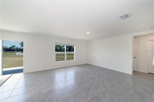 6683 SE 3rd Loop, Ocala, FL 34472 - empty room with light tile patterned floors, visible vents, baseboards, and recessed lighting