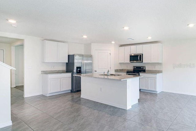 6683 SE 3rd Loop, Ocala, FL 34472 - kitchen with white cabinets, stainless steel appliances, and a sink