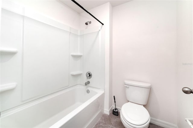 6683 SE 3rd Loop, Ocala, FL 34472 - full bath with baseboards, tile patterned floors, toilet, and tub / shower combination