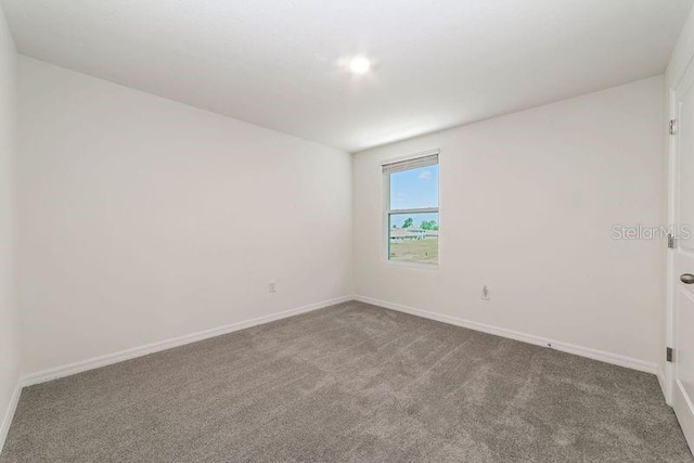 6683 SE 3rd Loop, Ocala, FL 34472 - carpeted spare room featuring baseboards