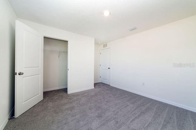 6683 SE 3rd Loop, Ocala, FL 34472 - unfurnished bedroom featuring baseboards, a closet, visible vents, and carpet