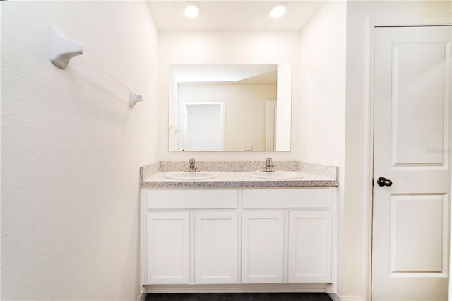 6683 SE 3rd Loop, Ocala, FL 34472 - bathroom with a sink, double vanity, and recessed lighting