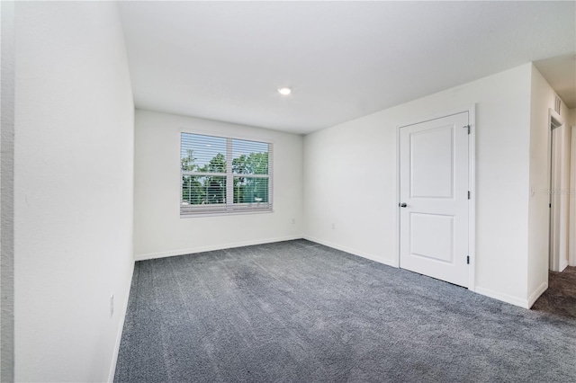 6683 SE 3rd Loop, Ocala, FL 34472 - empty room with dark colored carpet and baseboards