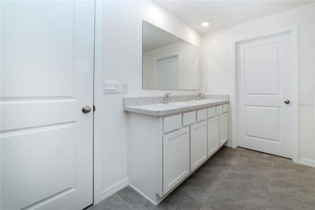 6683 SE 3rd Loop, Ocala, FL 34472 - bathroom featuring a sink, double vanity, baseboards, and recessed lighting