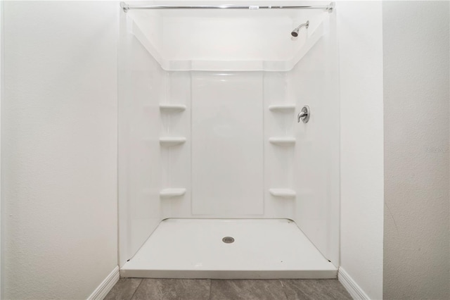 6683 SE 3rd Loop, Ocala, FL 34472 - bathroom featuring a shower and baseboards