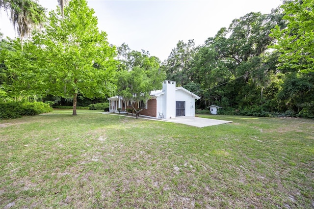 3436 SW 20th St, Gainesville, FL 32608 - view of yard with a patio