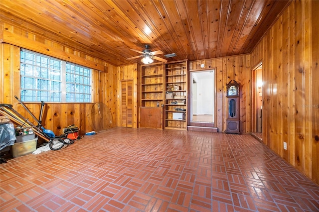 3436 SW 20th St, Gainesville, FL 32608 - interior space with wood walls, ceiling fan, brick floor, and wooden ceiling