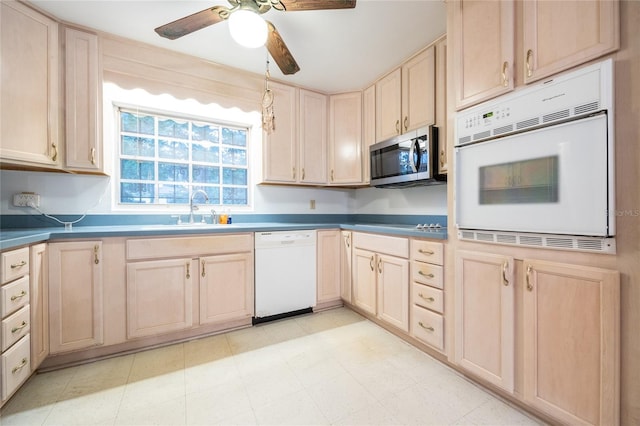 3436 SW 20th St, Gainesville, FL 32608 - kitchen with a sink, ceiling fan, light brown cabinets, and white appliances