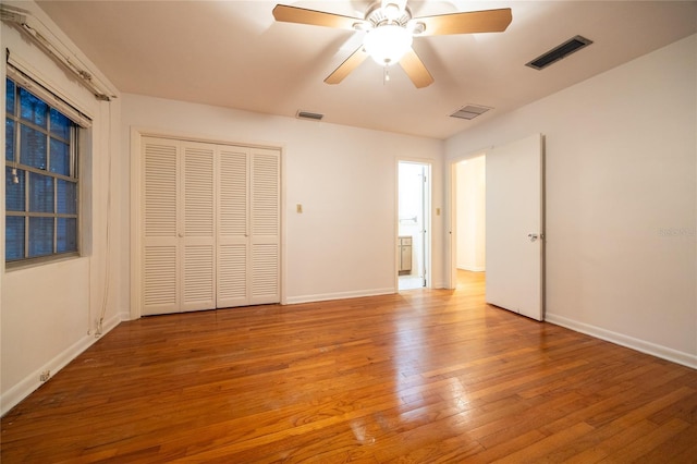 3436 SW 20th St, Gainesville, FL 32608 - unfurnished bedroom featuring visible vents, hardwood / wood-style flooring, and baseboards