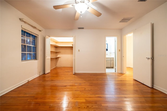 3436 SW 20th St, Gainesville, FL 32608 - interior space featuring baseboards, visible vents, hardwood / wood-style flooring, and a walk in closet