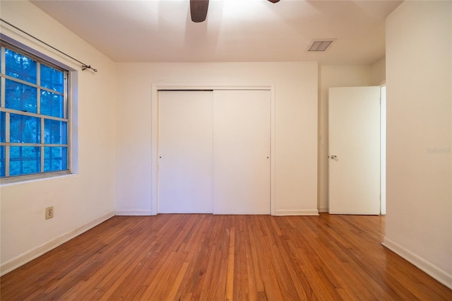 3436 SW 20th St, Gainesville, FL 32608 - unfurnished bedroom with visible vents, hardwood / wood-style flooring, baseboards, and a closet