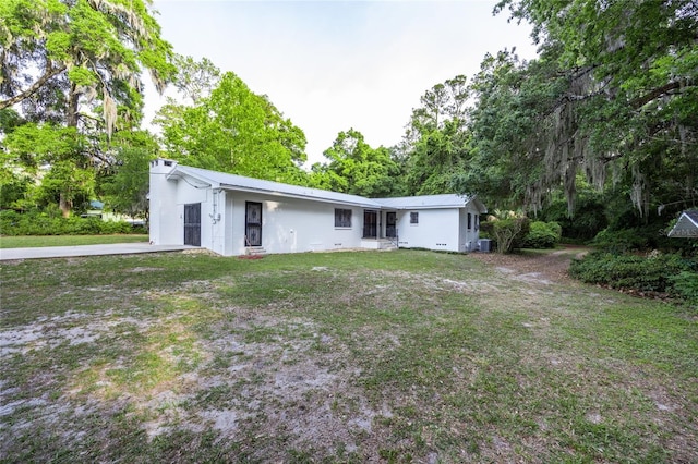 3436 SW 20th St, Gainesville, FL 32608 - rear view of house featuring a yard