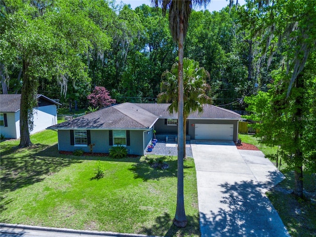 2423 NW 67th Ter, Gainesville, FL 32606 - ranch-style home featuring a shingled roof, driveway, a front yard, and a garage