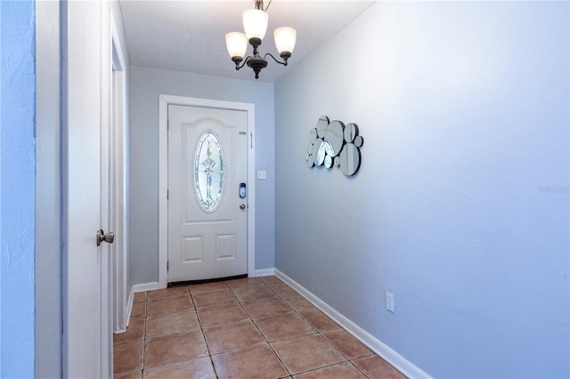 2423 NW 67th Ter, Gainesville, FL 32606 - tiled entrance foyer featuring baseboards and a notable chandelier