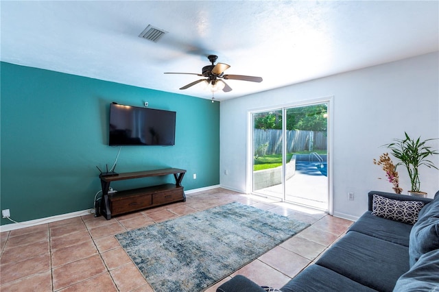 2423 NW 67th Ter, Gainesville, FL 32606 - living area with ceiling fan, baseboards, tile patterned floors, and visible vents